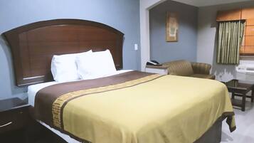 Desk, laptop workspace, blackout drapes, iron/ironing board