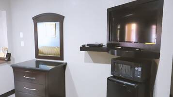 Desk, laptop workspace, blackout drapes, iron/ironing board