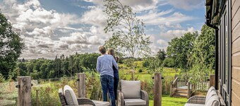 A luxury three-bedroom lodge with a modern lounge layout, perfect for families.