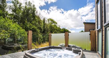 A luxury three-bedroom lodge with a modern lounge layout, perfect for families.