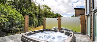A luxury three-bedroom lodge with a modern lounge layout, perfect for families.