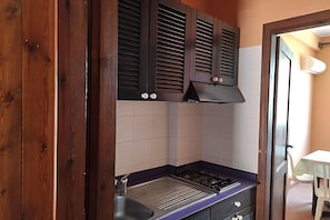 Microwave, stovetop, dining tables