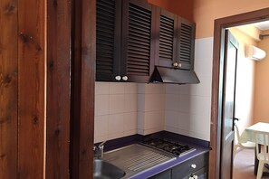 Microwave, stovetop, dining tables