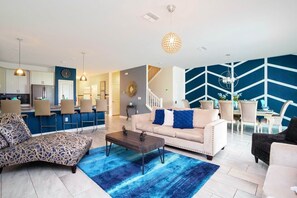 Townhome | Living area | 60-inch Smart TV with cable channels, Netflix, Hulu - Stunning 9 Bd Single Family w/ Pool @ Champions Gate 1508 (Davenport)