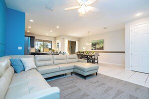 Townhome | Living room | 60-inch Smart TV with cable channels, Netflix, Hulu - Family Friendly 4Bd with Pool @ Solara Resort 1517 (Kissimmee)