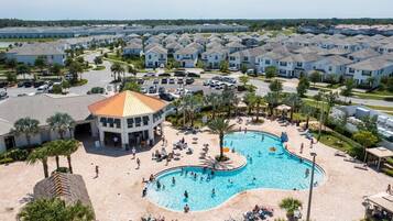 Outdoor pool, pool loungers, lifeguards on site