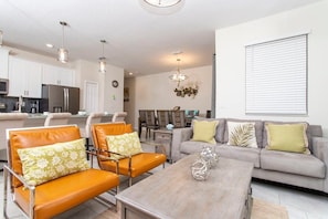 Townhome | Living area | 60-inch Smart TV with cable channels, Netflix, Hulu - Gorgeous Decor 4 Bd w/ Pool Close to Disney 4820 (Kissimmee)