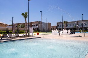 Outdoor pool, sun loungers, lifeguards on site