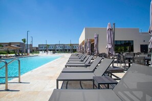Outdoor pool, sun loungers, lifeguards on site