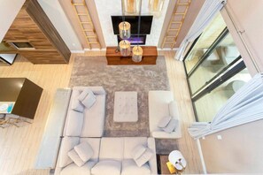 House | Living room | 60-inch Smart TV with cable channels, Netflix, Hulu - Accessible 4Bd Close to Disney @ Magic Village 7581 (Kissimmee)