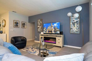Apartment | Living room | 60-inch Smart TV with cable channels, Netflix, Hulu - Stunning 5Bd w/ Pool Close to Disney @ Solterra 7829 (Davenport)