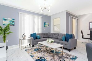 Townhome | Living room | 60-inch Smart TV with cable channels, Netflix, Hulu - Stunning 4 Bd w/ Pool Close to Disney @ Champions Gate 990 (Davenport)