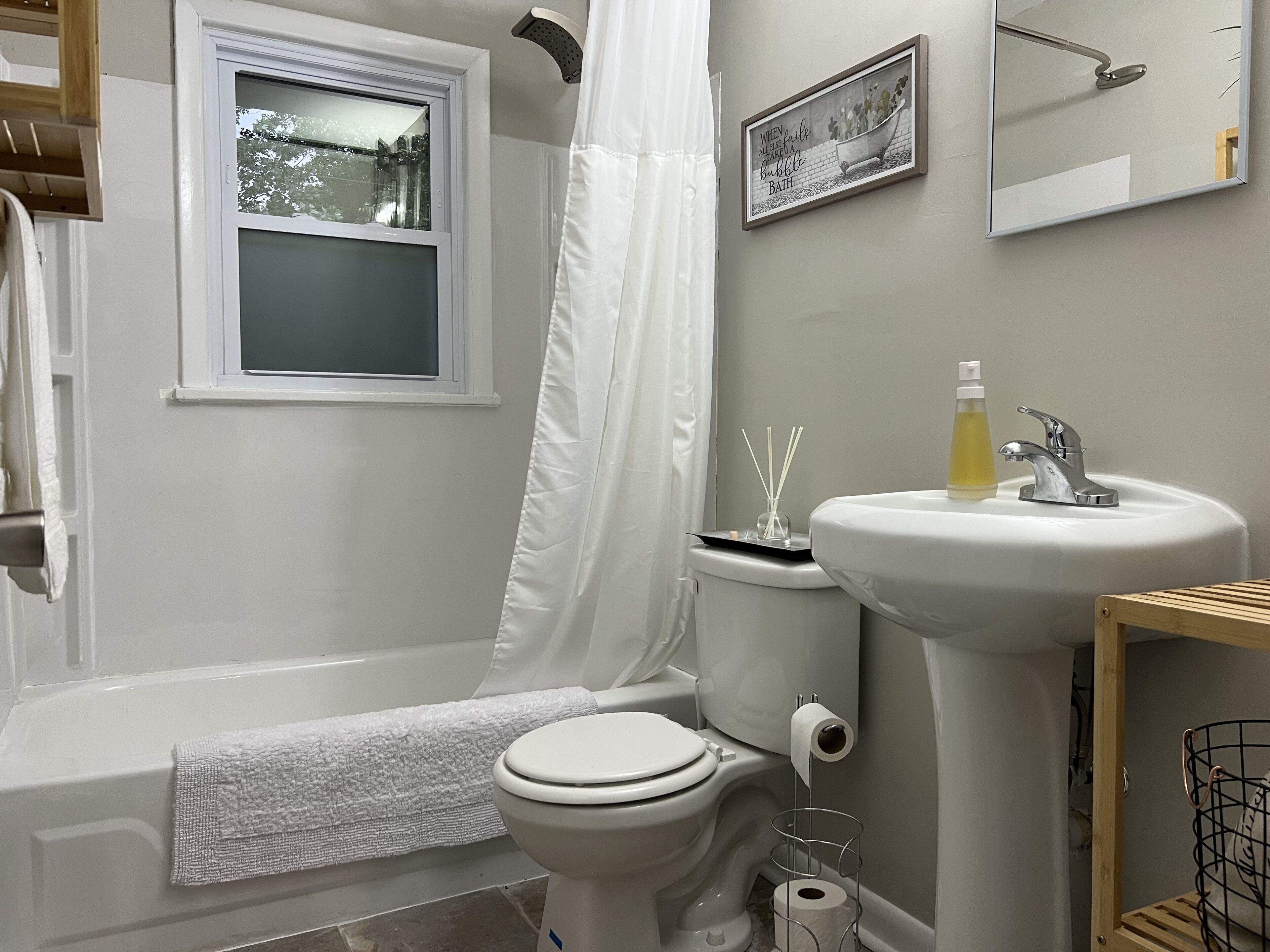 Combined shower/bathtub, hair dryer, towels, soap