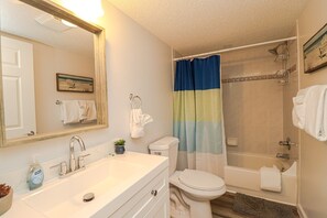 Bathtub, hair dryer, towels, soap