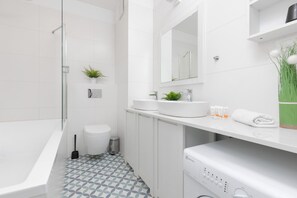 Bathtub, hair dryer, towels