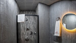 A modern bathroom with a shower, toilet, and sink. - Comfort Point (Istanbul)