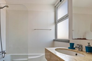 Bathtub, hair dryer, towels