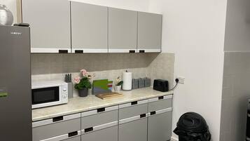 Mini-fridge, microwave, cookware/dishes/utensils