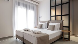 A double bed with a headboard, two bedside tables, and a large window with sheer curtains. - Mirena Luxury Living - Casa di Maria (Αφάντου)