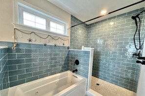 Combined shower/tub, hair dryer, towels, soap