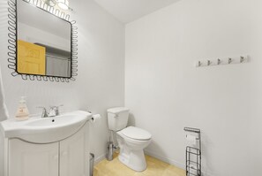 Combined shower/tub, hair dryer, towels, soap