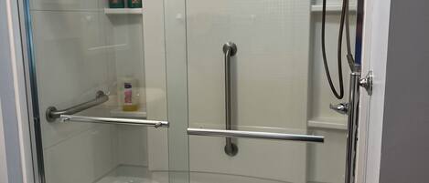 Shower, hair dryer, towels, shampoo