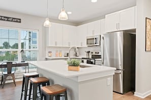 Fridge, microwave, oven, stovetop - Reluxme|Stylish 2BR w/ Balcony, Gym, Pool, Stores (Charlotte)