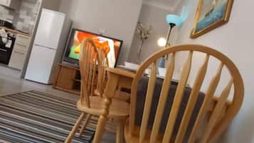 Comfort House, 4 Bedrooms | Living area | Flat-screen TV