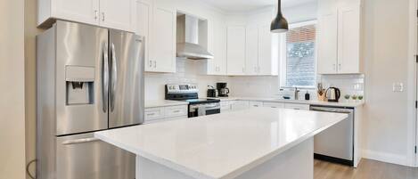 Grand Townhome, 2 Bedrooms, Non Smoking | Private kitchen | Full-size fridge, microwave, oven, stovetop