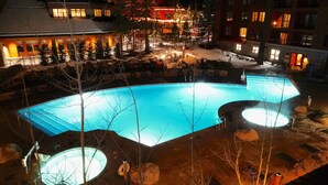 A large outdoor swimming pool with a circular hot tub, surrounded by lounge chairs and a covered seating area. - MARRIOTT Resort AUG 26,27 -130 USD-Hot tub -GYM -Kitchen (South Lake Tahoe)