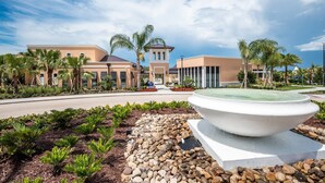 A resort with a central tower, palm trees, and a large fountain. - Solara 7BR with Private Pool/Game Room 22098 (Four Corners)