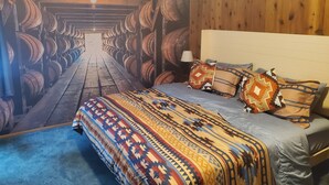 A bedroom with a bed, pillows, and a wall mural. - RiverPeace on the McKenzie (Blue River)