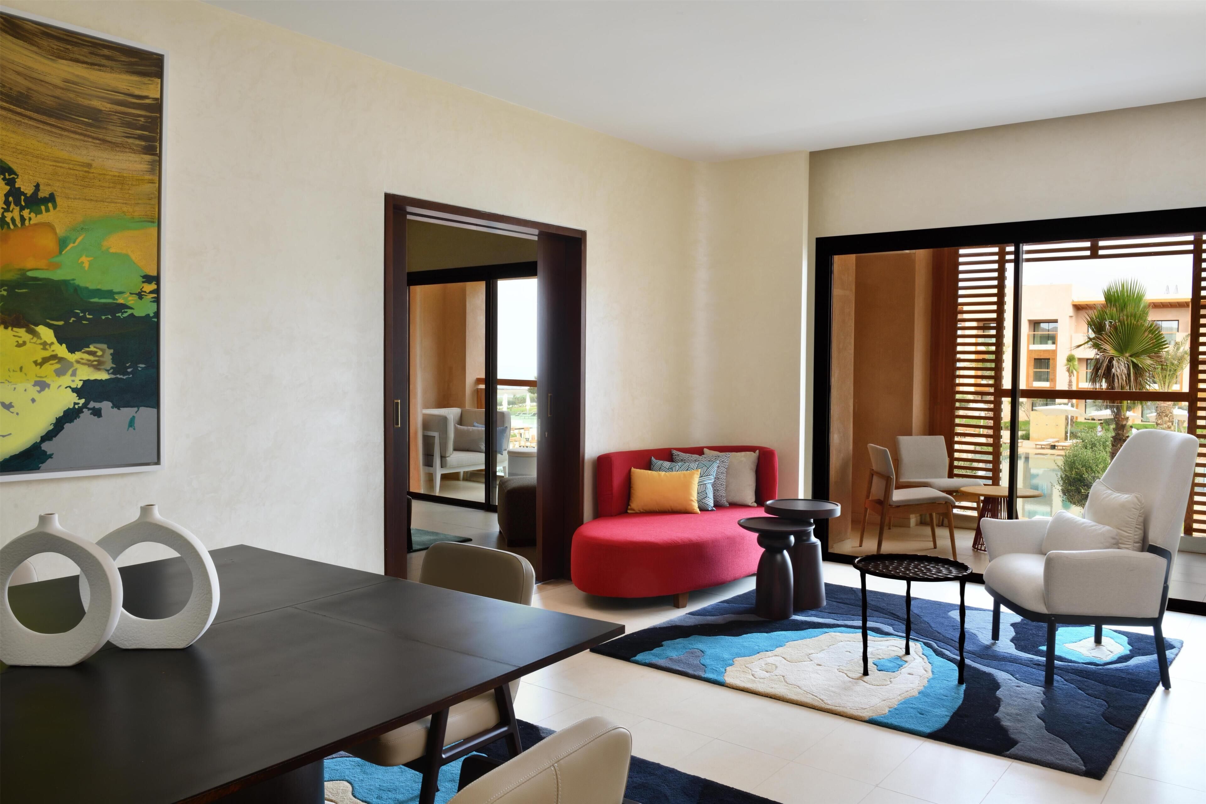 Suite, 1 King Bed, Pool View | Living area | 55-inch LED TV with digital channels, TV, toys