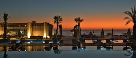 Indoor pool, 5 outdoor pools, open 9:00 AM to 6:00 PM, pool umbrellas