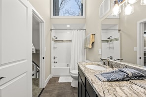 Combined shower/tub, hair dryer, towels, soap
