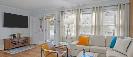 Smart TV, fireplace, books, computer monitors