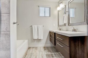 Combined shower/tub, hair dryer, towels, soap