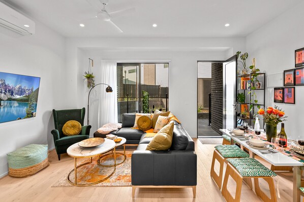 Deluxe Townhome | Living area | 65-inch Smart TV with digital channels, TV, Netflix - StayCentral - Boulevard Gardens (Coburg)