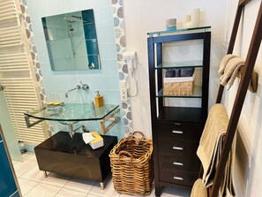 Shower, hair dryer, towels, soap