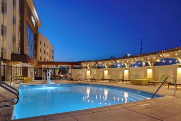 Outdoor pool, open 7:00 AM to 10:00 PM, pool umbrellas, pool loungers