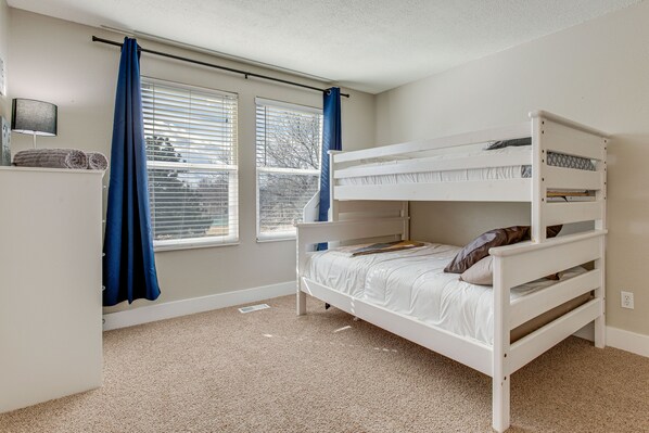A bunk bed room with a window, curtains, and a lamp. - 6 Mi to Dtwn: Arvada Home w/ Hot Tub & Yard (Arvada)