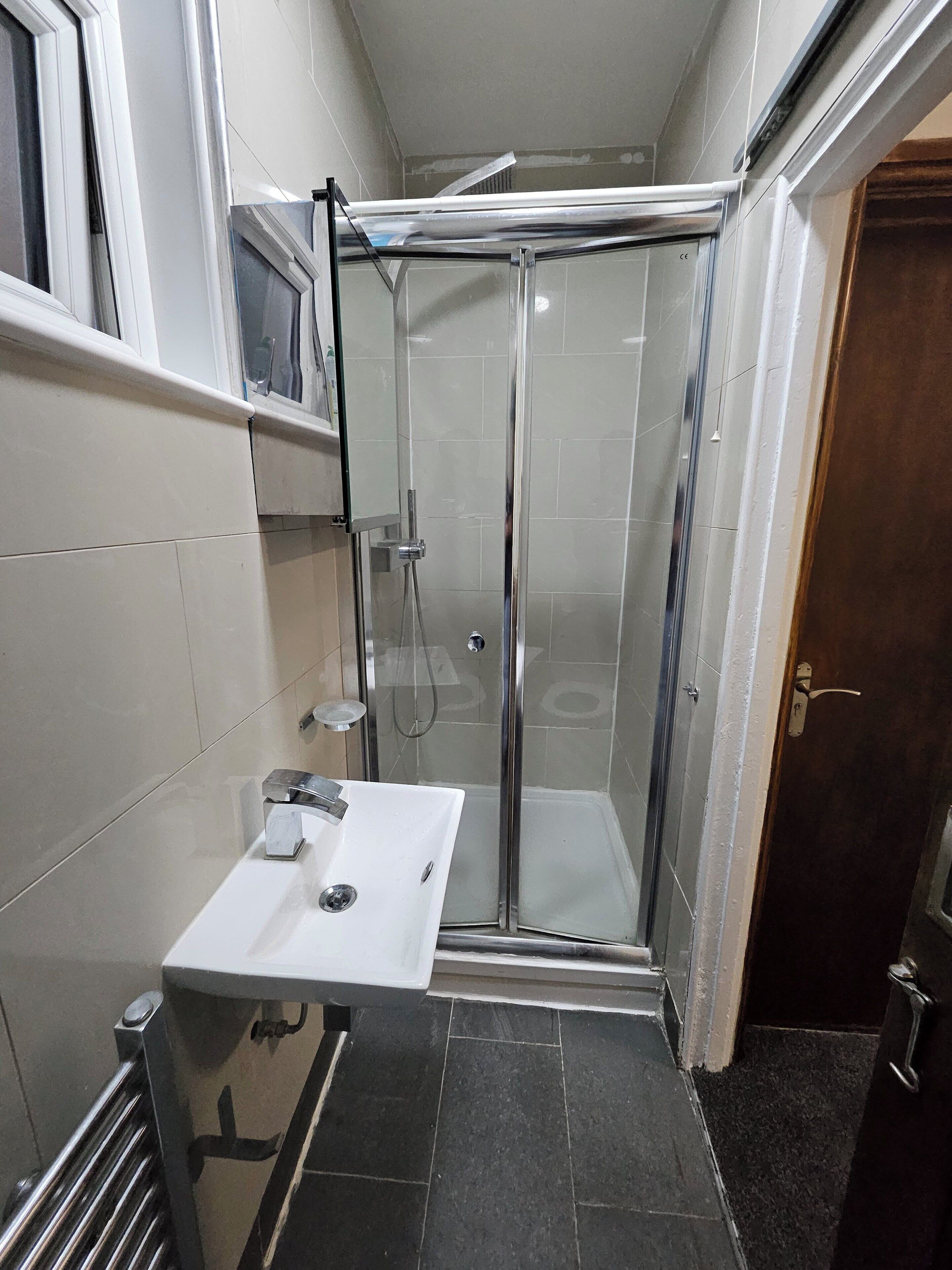 Shower, free toiletries, towels, toilet paper