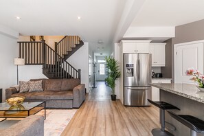 Luxury Townhome, 5 Bedrooms, Hot Tub | Living area | 43-inch flat-screen TV with digital channels, TV, fireplace - GLOBALSTAY. Waterfront 5BR Townhouse. Private HOT TUB, Gym, Sauna (Hamilton)