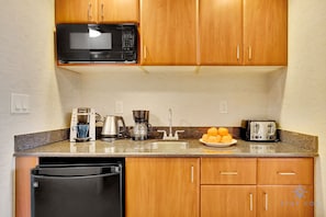 Coffee/tea maker, microwave, toaster, cookware/dishes/utensils