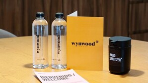 A welcome package including two bottles of 'Poonwal' water, a 'Wynwood House' box, and a 'Hand Sanitizer' bottle. - w* | Fascinating 1BR with Perfect Deco in Polanco (Ciudad de México)