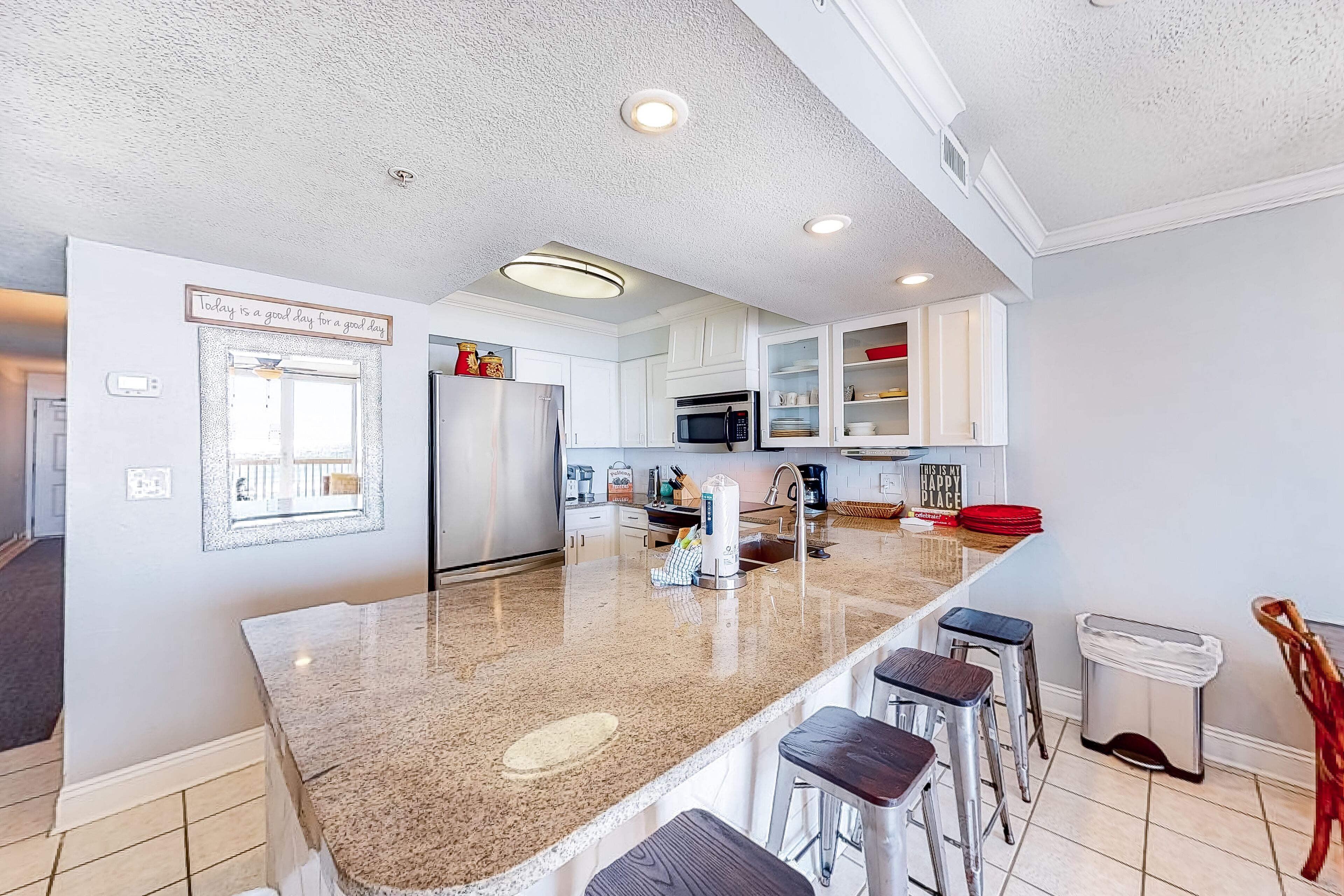 Gulf-front condo with balcony, water views, pools, hot tub & beach access