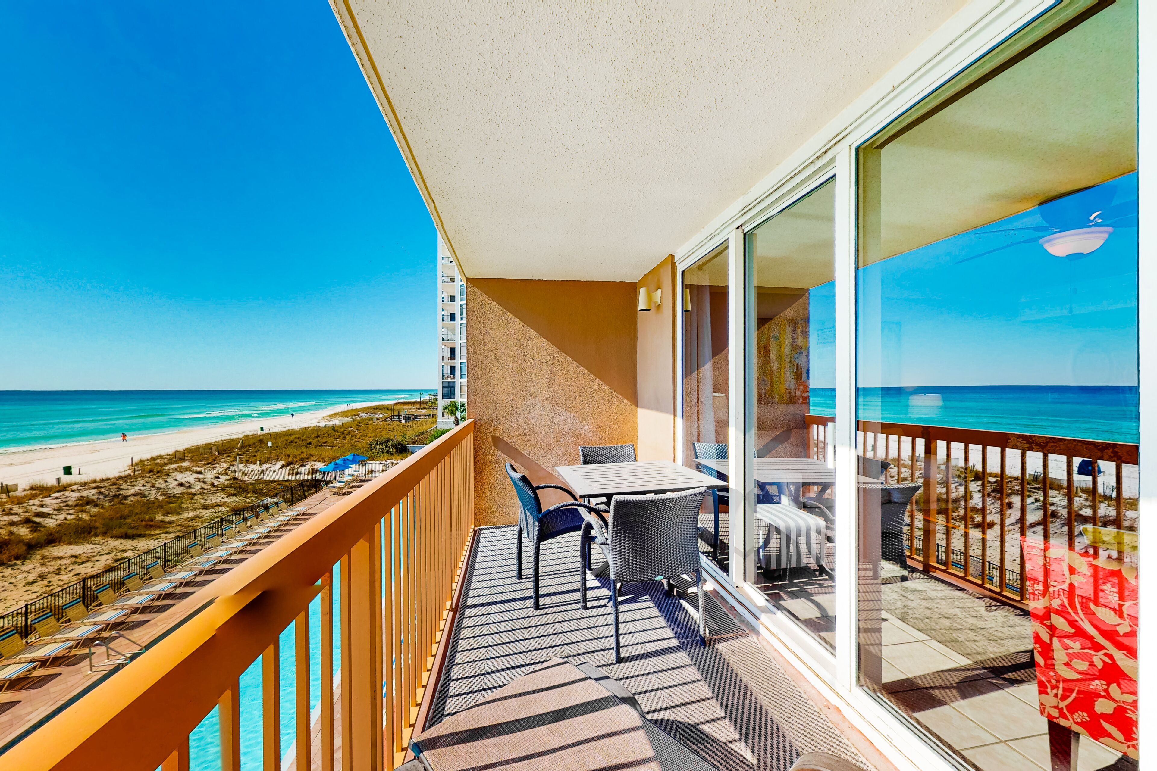 Gulf-front condo with balcony, water views, pools, hot tub & beach access