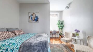 1 bedroom, desk, iron/ironing board, travel crib