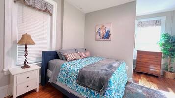 1 bedroom, desk, iron/ironing board, travel crib