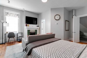 1 bedroom, desk, iron/ironing board, travel crib